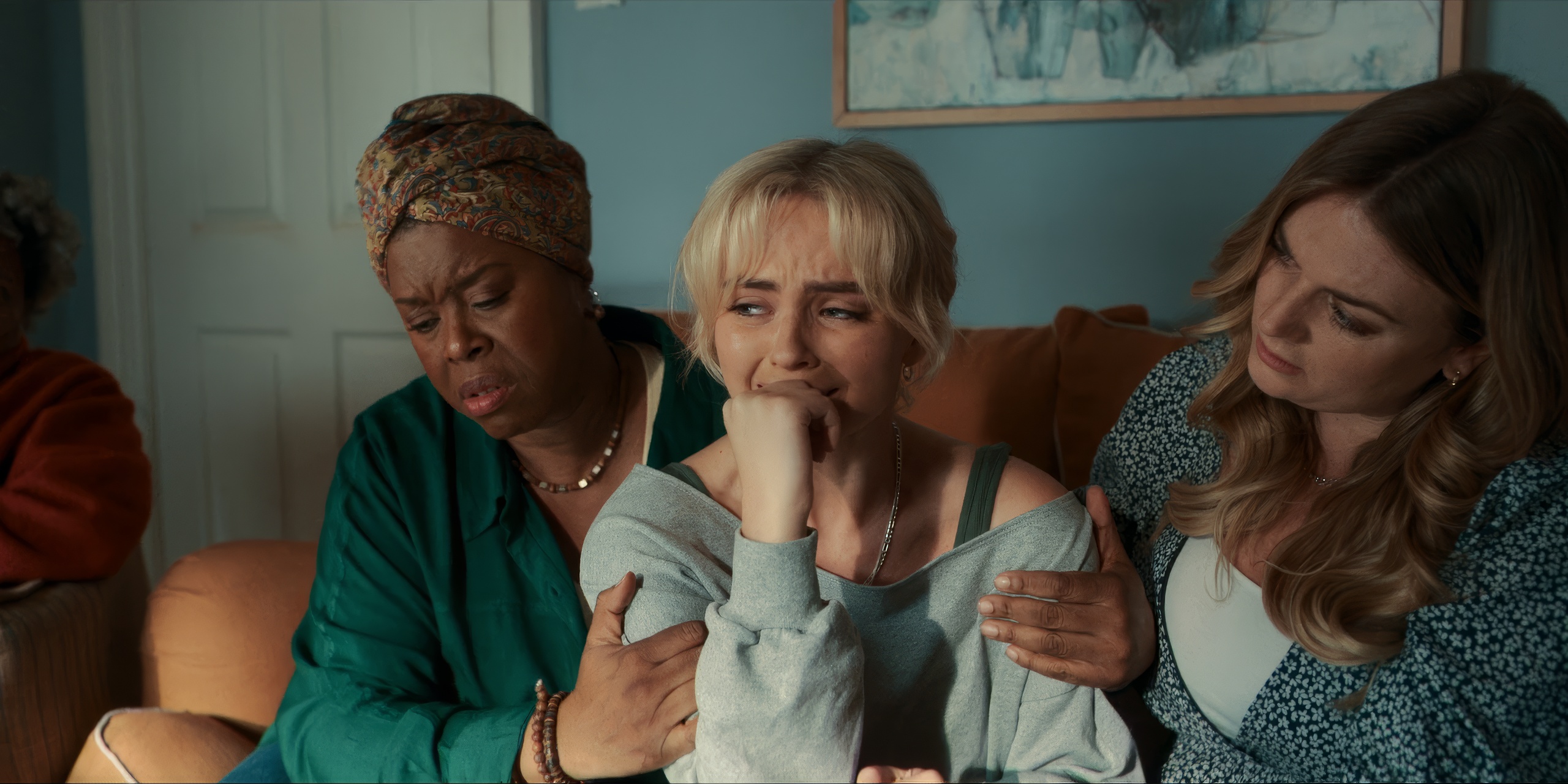 Ruby, crying in her house with her mums